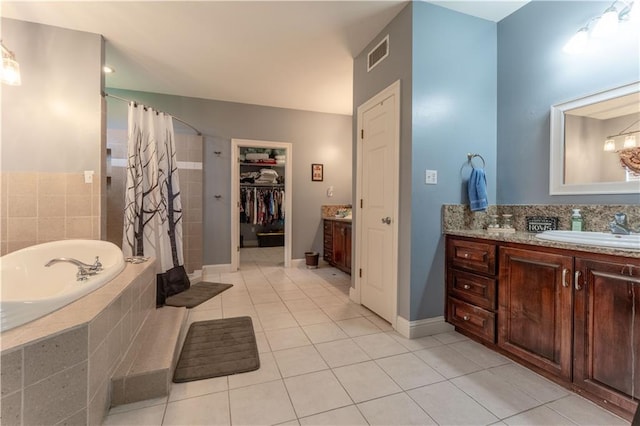 31 Allen Hill Rd, Tylertown, MS 39667 - bathroom featuring tile patterned floors, vanity, a bath, and tiled shower