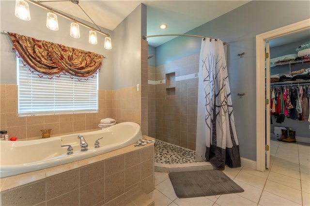 31 Allen Hill Rd, Tylertown, MS 39667 - bathroom featuring a tile shower, a garden tub, tile patterned flooring, and a walk in closet