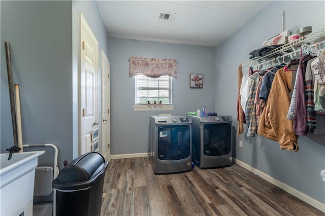 31 Allen Hill Rd, Tylertown, MS 39667 - laundry area with washer and clothes dryer and wood finished floors