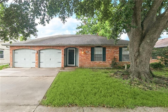 2041 Glencove Ln, Terrytown, LA 70056 - ranch-style house featuring an attached garage, concrete driveway, a front lawn, and brick siding