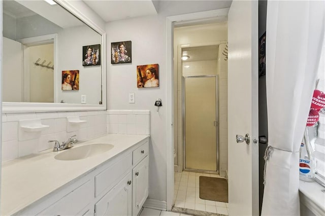 2041 Glencove Ln, Terrytown, LA 70056 - bathroom featuring a stall shower, vanity, tile patterned floors, and backsplash