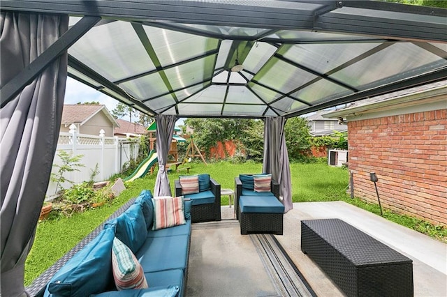 2041 Glencove Ln, Terrytown, LA 70056 - fenced backyard featuring an outdoor hangout area, a playground, a patio, and a gazebo