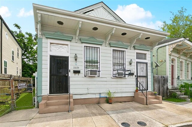 222325 Felicity St, New Orleans, LA 70113 - shotgun-style home featuring entry steps and cooling unit