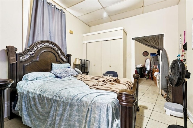 222325 Felicity St, New Orleans, LA 70113 - bedroom featuring a paneled ceiling, light tile patterned floors, and a closet