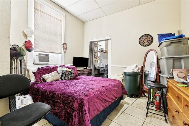 222325 Felicity St, New Orleans, LA 70113 - bedroom featuring a drop ceiling, tile patterned floors, and cooling unit