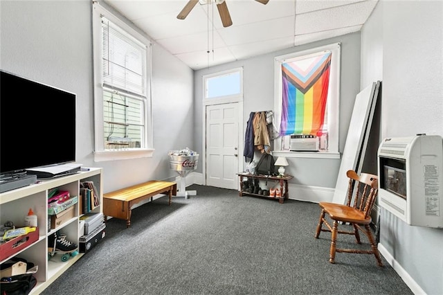 222325 Felicity St, New Orleans, LA 70113 - sitting room with heating unit, carpet, ceiling fan, a paneled ceiling, and cooling unit