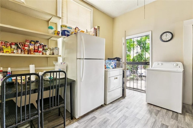 222325 Felicity St, New Orleans, LA 70113 - kitchen with washer / clothes dryer and freestanding refrigerator