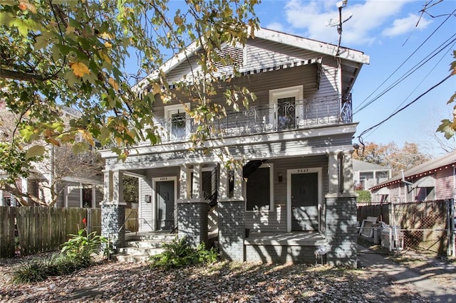 5227-29 Coliseum St, New Orleans, LA 70115 - view of front facade featuring a balcony, a porch, and a gate