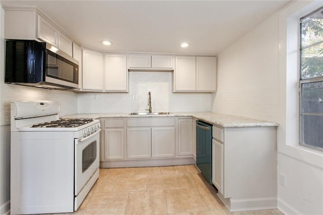 5227-29 Coliseum St, New Orleans, LA 70115 - kitchen featuring white gas range oven, stainless steel microwave, decorative backsplash, dishwasher, and recessed lighting