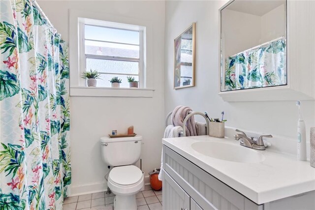 5227-29 Coliseum St, New Orleans, LA 70115 - bathroom with vanity, tile patterned flooring, and curtained shower