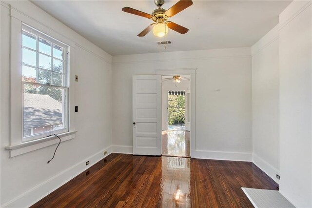 5227-29 Coliseum St, New Orleans, LA 70115 - empty room with plenty of natural light, wood finished floors, and ceiling fan