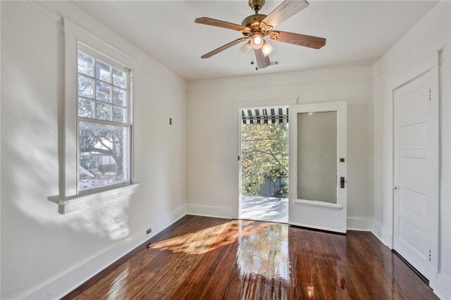 5227-29 Coliseum St, New Orleans, LA 70115 - spare room featuring wood-type flooring and a ceiling fan