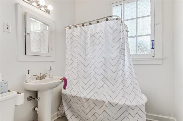 5227-29 Coliseum St, New Orleans, LA 70115 - bathroom featuring plenty of natural light and curtained shower