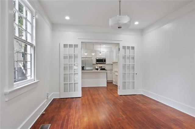 5227-29 Coliseum St, New Orleans, LA 70115 - unfurnished dining area with french doors, plenty of natural light, dark wood finished floors, and recessed lighting