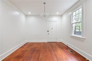 5227-29 Coliseum St, New Orleans, LA 70115 - unfurnished room with wood finished floors and recessed lighting