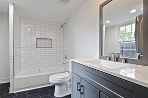 5227-29 Coliseum St, New Orleans, LA 70115 - bathroom featuring vanity, tile patterned flooring, and bathing tub / shower combination