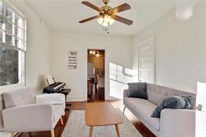 5227-29 Coliseum St, New Orleans, LA 70115 - living room with healthy amount of natural light, a ceiling fan, and wood finished floors