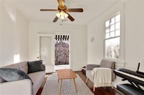 5227-29 Coliseum St, New Orleans, LA 70115 - living area with a ceiling fan and wood finished floors