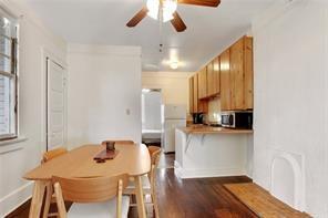 5227-29 Coliseum St, New Orleans, LA 70115 - dining room with ceiling fan and dark wood-style floors