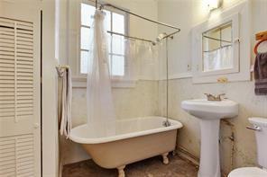 5227-29 Coliseum St, New Orleans, LA 70115 - full bath featuring toilet and a combined bath / shower with freestanding tub