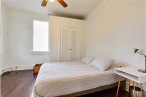 5227-29 Coliseum St, New Orleans, LA 70115 - bedroom with wood finished floors and ceiling fan