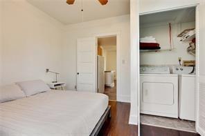 5227-29 Coliseum St, New Orleans, LA 70115 - bedroom featuring washing machine and dryer and dark wood-type flooring