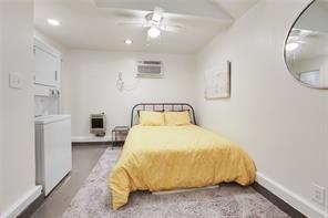 5227-29 Coliseum St, New Orleans, LA 70115 - bedroom with washer / dryer, recessed lighting, an AC wall unit, and ceiling fan