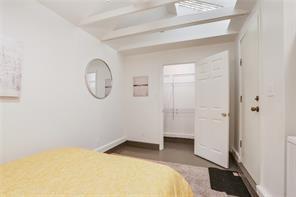 5227-29 Coliseum St, New Orleans, LA 70115 - unfurnished bedroom with beam ceiling and a closet
