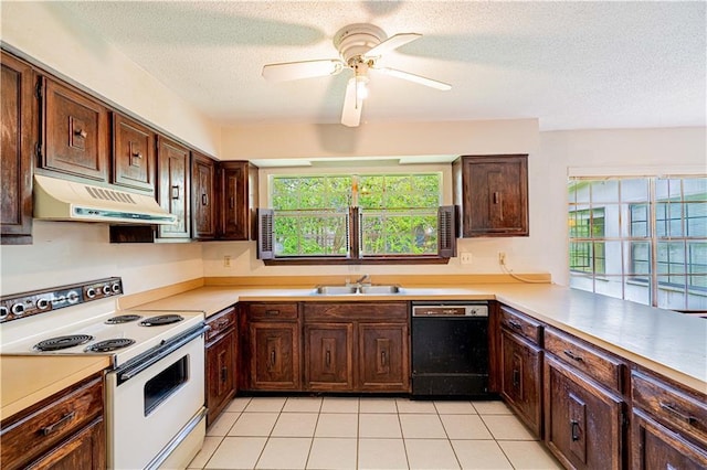 210 Lake Ontario Ct, Slidell, LA 70461 - kitchen with black dishwasher, white range with electric cooktop, under cabinet range hood, healthy amount of natural light, and a textured ceiling