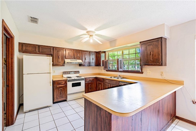 210 Lake Ontario Ct, Slidell, LA 70461 - kitchen featuring white appliances, under cabinet range hood, a peninsula, a ceiling fan, and light countertops