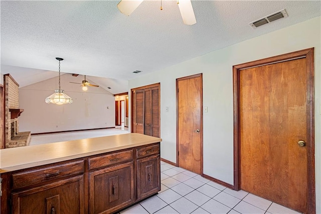 210 Lake Ontario Ct, Slidell, LA 70461 - kitchen featuring a ceiling fan, light countertops, a textured ceiling, hanging light fixtures, and lofted ceiling