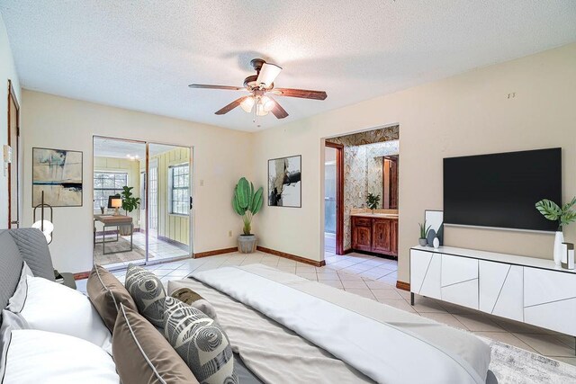 210 Lake Ontario Ct, Slidell, LA 70461 - bedroom with access to exterior, light tile patterned flooring, a textured ceiling, connected bathroom, and ceiling fan