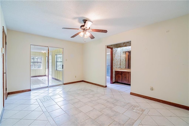 210 Lake Ontario Ct, Slidell, LA 70461 - spare room with light tile patterned floors, ceiling fan, and a textured ceiling
