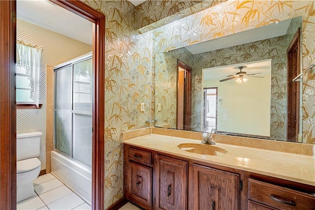 210 Lake Ontario Ct, Slidell, LA 70461 - full bath with wallpapered walls, vanity, tile patterned floors, a ceiling fan, and enclosed tub / shower combo