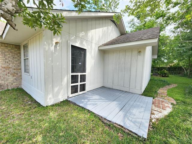210 Lake Ontario Ct, Slidell, LA 70461 - back of property with a yard and brick siding