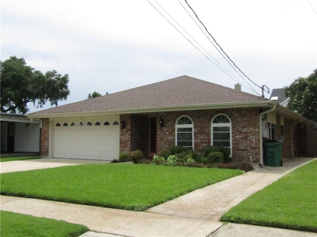 4908 Wills St, Metairie, LA 70006 - ranch-style home with a front yard, a garage, brick siding, and driveway