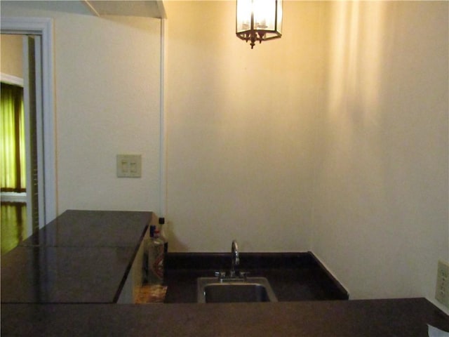 4908 Wills St, Metairie, LA 70006 - bathroom with a sink and a chandelier