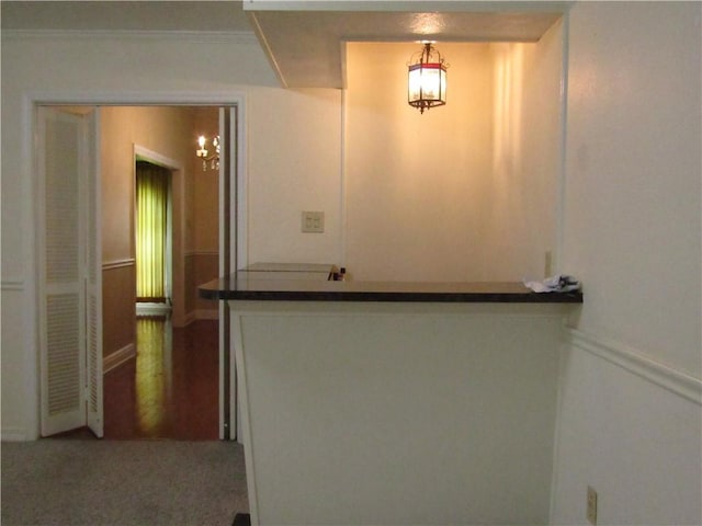 4908 Wills St, Metairie, LA 70006 - corridor featuring a chandelier