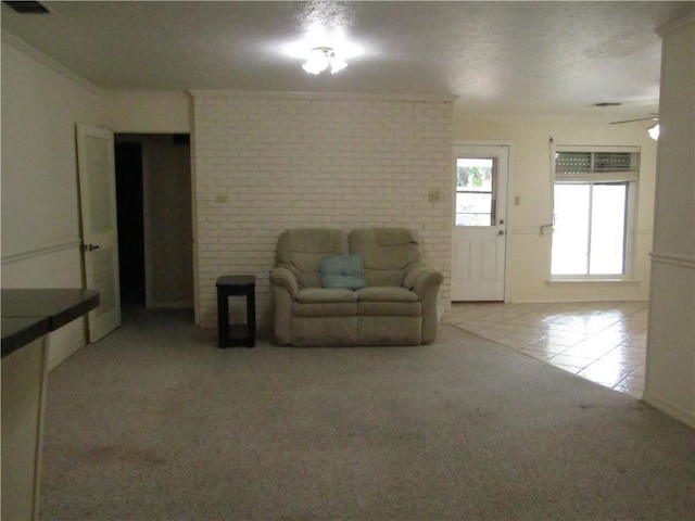 4908 Wills St, Metairie, LA 70006 - carpeted living area featuring tile patterned flooring, crown molding, and a ceiling fan