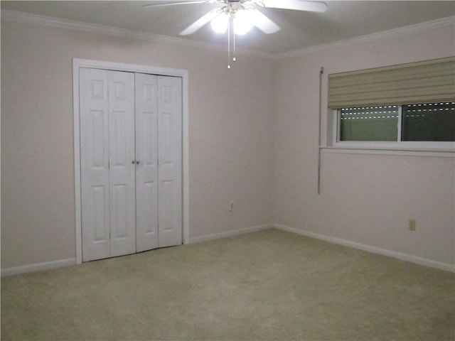 4908 Wills St, Metairie, LA 70006 - unfurnished bedroom featuring carpet floors, crown molding, a ceiling fan, and a closet