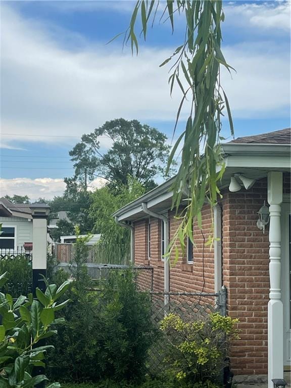 2711 Claire Ave, Gretna, LA 70053 - view of side of home featuring brick siding and roof with shingles