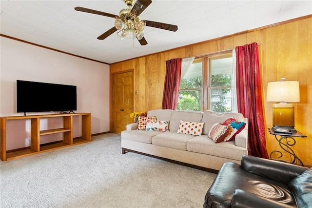 638 Huntlee Dr, New Orleans, LA 70131 - living room with crown molding, a ceiling fan, wooden walls, and carpet