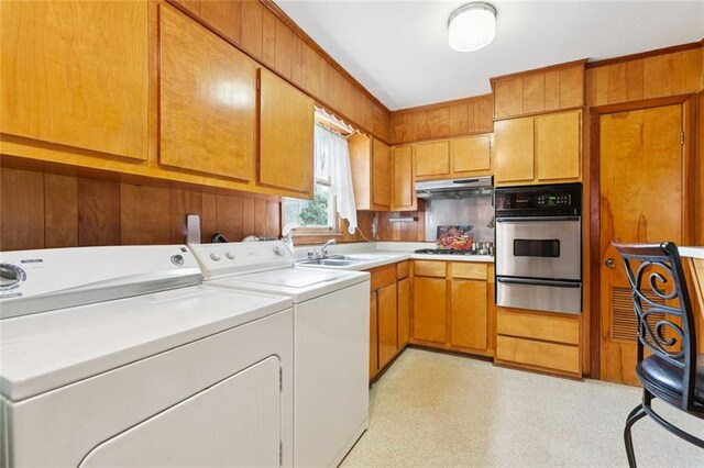 638 Huntlee Dr, New Orleans, LA 70131 - laundry area with washer and dryer, cabinet space, and light floors