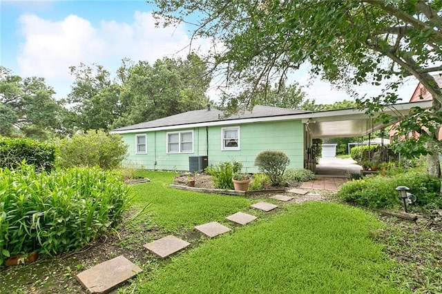 638 Huntlee Dr, New Orleans, LA 70131 - rear view of property featuring a yard and an attached carport