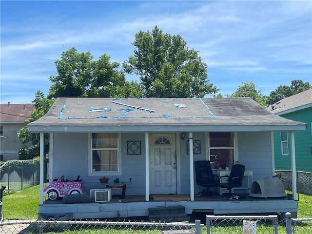 2709 Cherry St, New Orleans, LA 70118 - bungalow-style home featuring covered porch and a fenced front yard