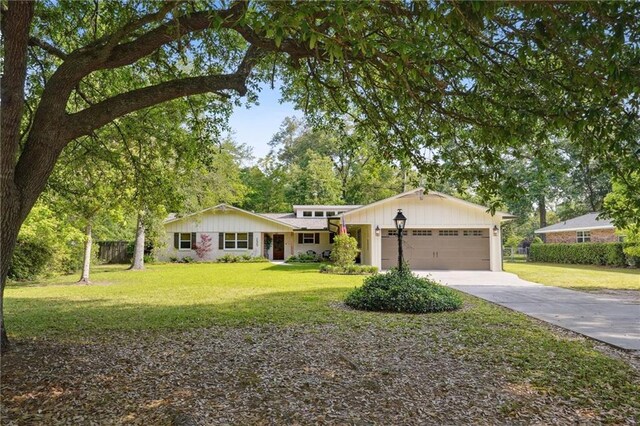 133 Crapemyrtle Rd, Covington, LA 70433 - view of front of property with driveway and a garage
