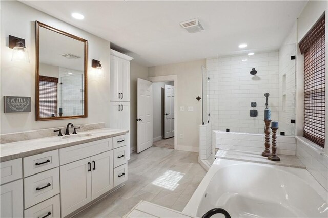 133 Crapemyrtle Rd, Covington, LA 70433 - bathroom featuring vanity, a bath, a tile shower, and recessed lighting