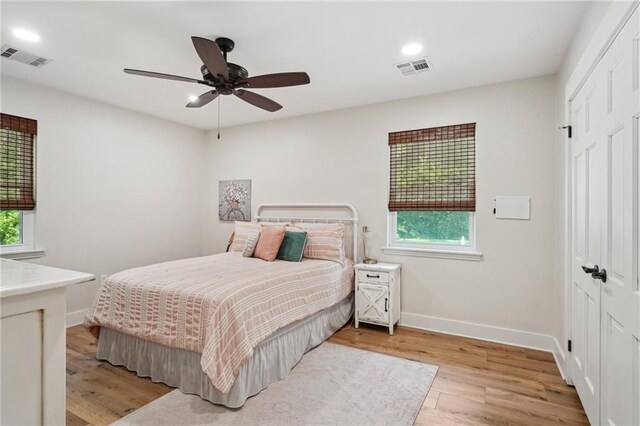 133 Crapemyrtle Rd, Covington, LA 70433 - bedroom featuring a closet, multiple windows, light wood finished floors, recessed lighting, and a ceiling fan