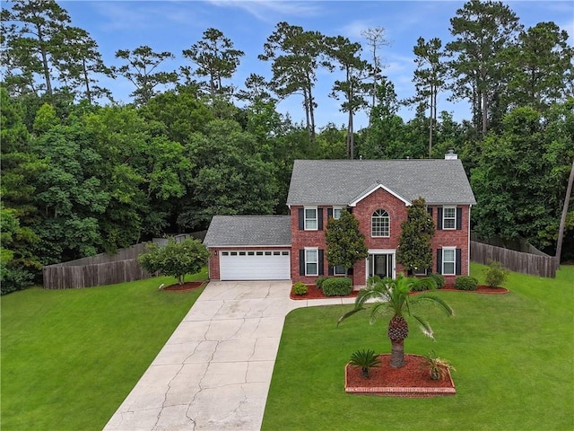 2009 Rubich Ln, Slidell, LA 70461 - colonial inspired home with brick siding, a garage, driveway, a chimney, and roof with shingles