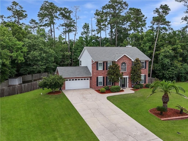 2009 Rubich Ln, Slidell, LA 70461 - colonial-style house featuring brick siding, driveway, and an attached garage